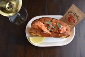 Add sliced kielbasa sausage and lobsters one at a time. Bob S Lobster