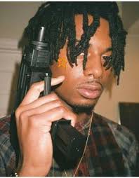 Lil black jean jacket got vlone on it!*. Playboi Carti