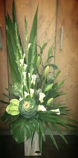 Like The Use Of Greens And Lilies For Palm Sunday I D Leave Out The Orn Large Flower Arrangements Contemporary Flower Arrangements Fresh Flowers Arrangements