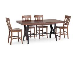 They basically feature various surfaces with different heights so everyone a counter placed at a lower height brings down the eating area to a more comfortable level and can be used in combination with regular dining chairs. The District Counter Height Dining Room Set Furniture Row