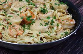 Place the pasta in a warmed serving dish and toss with the remaining 1 t butter Shrimp And Scallop Pasta In White Wine Cream Sauce System Of A Brown