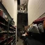 Stairs to props and costume storage in a theater.