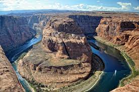 The colorado river flows 1,450 mi (2,330 km) from its headwaters in the rocky mountains of colorado south into mexico, where it empties into the gulf of california. Colorado River Wikipedia