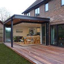 This patio is neither expensive nor difficult to build. The Slide To Outside 7 Ways To Use Sliding Glass Doors In Your Home Decor House Extension Design House Extensions House Exterior