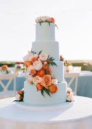 Elegant Seaside Wedding With A Pop Of Orange Wedding Cakes Blue Spring Wedding Cake Wedding Cakes With Flowers