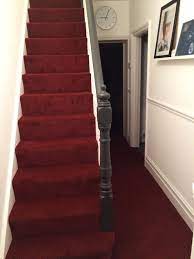 Grey Feature Banisters And Handrails Contrast With Stark Matt White Walls And Red Carpet Stair Runner Carpet Stairway Carpet Cheap Carpet Runners