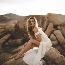 Beach photoshoot ideas for models. The World Was Hushed Into Her Silence Those Soft Curves Covered In White Clouds Wild And Brigh Photography Poses Women Photography Women Beach Photoshoot