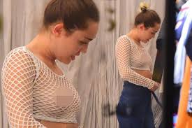 Braless Miley Cyrus flashes her nipples in completely see-through ...