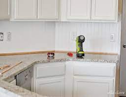 A backsplash design is anything that you can put on the wall behind your stove, to make it look better. 30 Beadboard Kitchen Backsplash Tutorial Ella Claire Co