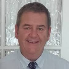 The sun rising to the east as Wicklow Head lighthouse and Brides Head looks  on. It's not often you get to anchor in your own backyard. Commissioners of  Irish Lights ILV Granuaile