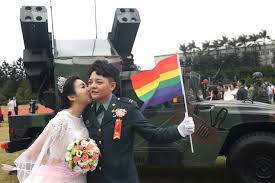 Coming out bravely'- Taiwan same-sex couples join military wedding for  first time | Reuters