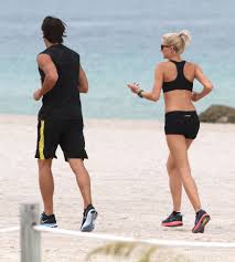 Lena Gercke And Sami Khedira Photos Photos Sami Khedira And Lena Gercke Out For A Jog On The Beach Run Lena Gercke Lena Gercke Sami Khedira Und Lena
