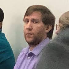 Tennessee teacher who admitted to filming students in locker room cries in  court