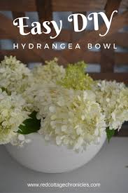 Multicolor mauve, blue, and pink hydrangea, as well as pink spray roses, make up this classic arrangement. This Easy Diy Hydrangea Arrangement Dresses Up Our Mid Summer Mantel