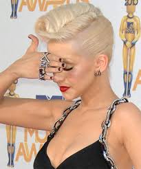 This chin length curly hair style perfectly frames your face and works best for women with thin curly hair. Christina Aguilera Medium Curly Updo