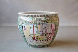 Antique chinese, hand painted fish bowl adorned with butterflies and flowers on the exterior and goldfish on the interior. 20th Century Chinese Hand Painted Fish Bowl Planter Or Jardiniere At 1stdibs