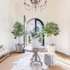 The width of your entryway will ultimately determine which type of table is right for you. Middle Of Foyer Round Table Design Ideas