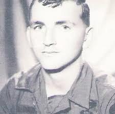 U.S. Navy veteran Dale Franks salutes the American Flag at the Memorial  High School Veterans Day tribute. He is a member of the Ely Honor Guard.