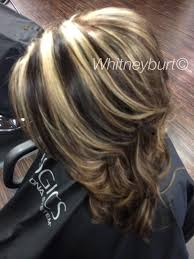 These caramel highlights bring some life to the front of the hair. Chocolate Lowlights And Bold Blonde Highlights By Me Pinwheel Hair Color Blonde Highlights Mom Hairstyles