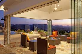 The exposed brick wall, wood floors and tall, sunny windows were already there when this designer showed up. Modern Glass Wall Design Ideas For Modern House