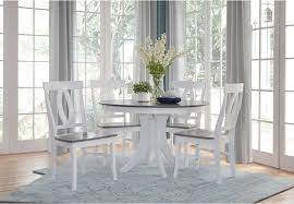 This sleek white kitchen table set is perfect for you if you want something that can accommodate guests, too. Ww59 Grey And White Round 5 Piece Set