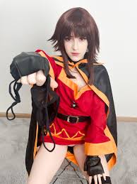 stelarhoshi, megumin, kono subarashii sekai ni shukufuku wo!, wall,  absurdres, cosplay photo, highres, photo (medium), 1girl, belt, black cape,  black gloves, black panties, black thighhighs, blunt bangs, brown hair,  cape, carpet, chair,
