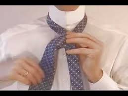 Put the tie around your neck. How To Tie A Tie Easy Step By Step Instructions Youtube