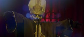 A square hammer is a metaphor that might point to each strike of the hammer being done by the square person, thus actions being honest and trustworthy and the coffin in fact being sacred and not tainted by the working man. Ghost Shows Off Sinister Student Talent In Cirice Music Video