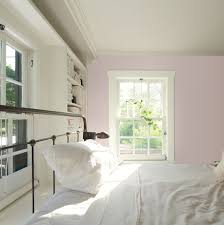 Walls Painted A Barely There Lavender Are A Cozy Touch In A Farmhouse Style Bedroom Best Interior Paint Purple Paint Colors Benjamin Moore Affordable Interiors