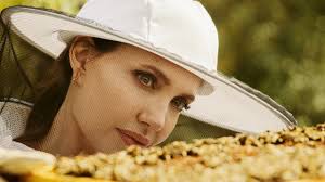 Jolie wore a long, flowing, strapless white dress for the photos. Angelina Jolie And Guerlain Want To Save The Bees And Empower Female Beekeepers Vogue