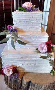Buttercream Wedding In Square Tiers Garnished With Fresh Flowers Square Wedding Cakes Wedding Cakes With Flowers Buttercream Wedding Cake