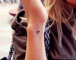 These lock and heart tattoos represent a very positive message to others. Top 10 Cute And Small Tattoo Ideas And Their Meanings Side Wrist Tattoos Wrist Tattoos Girls Tiny Heart Tattoos