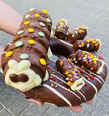 Today Is National Eat What You Want Day! 🎉 So we have picked out 10 of our  most favourite doughnut creations, we have ever made! From Colin the  Caterpillar to a Peperami