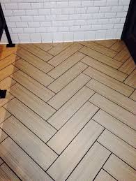 Ceramic Tile Floor With Wood Grain Laid Out In A Fish Bone Pattern Interior Architecture Design Ceramic Floor Tiles Chevron Tile