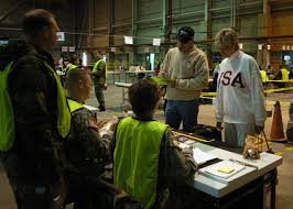 File:US Navy 070223-N-7581R-039 Lt Cmdr. Kathy McCall and Jimmy McCall,  Neptune Response '07 participants, simulate checking their pet into the  veterinary booth at the Naval Air Station Operating Base Processing  Center.jpg -