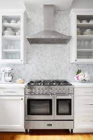 Marble hex tile kitchen backsplash. Gray Marble Hexagon Tiles With Stainless Steel Range And Hood Transitional Kitchen