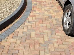 45 degree herringbone paver pattern with running border and header versastone block and cap paved garden wall with eurostone zurich pavers versawall block with split face cap and bondi blend stradapave paving Marshalls Paving Co Operative Contractors Ltd