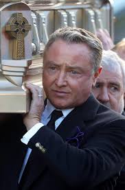 Michael Flatley pays emotional tribute to his mother by playing flute at  her funeral mass in Co Carlow
