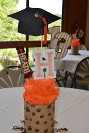 Homemade Graduation Table Centerpiece With Paw Print Wrappin Graduation Party Table Decorations Outdoor Graduation Parties Outdoor Graduation Party Decorations