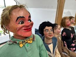 Speak no evil! Terrifying ventriloquist's dummy pictured with its 'owner'  in the 1920s is among husband and wife's collection of more than 20 dolls  set to fetch up to £8,000 at auction |