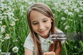 Portrait Of Girl In Wheat Field Smiling High-Res Stock Photo