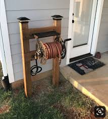 Hose Roller Upper Really Good Sturdy Stand And Rolling Wheel Garden Hose Storage Outdoor Projects Hose Storage