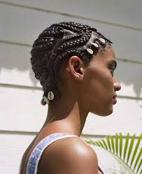 The cornrows are designed into a heart which makes quite the cute little hairstyle. 9 Beachy Hairstyles By Braid Artist Shani Crowe Allure