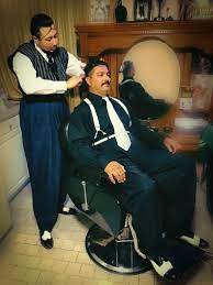 The Chicano Classic Slick Back Haircut With Your Three Flowers Brilliantine And Hairnet Q Vo East Los Traditional Barber E In 2021 Zoot Suit Slick Back Haircut Chicano