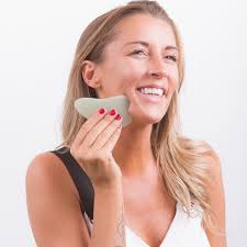 White Lotus signature Jade Gua Sha massager in silk lined box