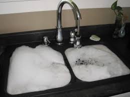 how to fix a clogged kitchen sink on