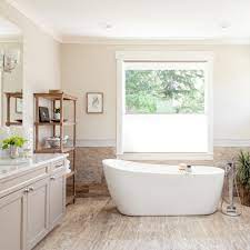 As a more modern element, the bath tub taps, rain shower and telephone shower are all in a chrome finish. Natural Travertine Bathroom Floors Redefine Luxury