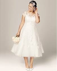 The illusion sheer bodice, allover lace, and tulle enhance this romantic look. 7 Gorgeous Short Plus Size Summer Wedding Dresses