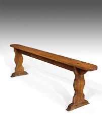 This substantial piece has a sturdy oak frame, 6 legs, side arms, and back and seat cushions covered in black. Antique Bench Hall Seat Antique Wooden Bench Elm Hall Bench Victorian Bench Elm Bench Antique Stool Antique Foot Stool Antique Dressing Table Stool Uk Antique Stools