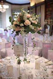Tall Vase Table Display By Exclusively Weddings Photo By Adam Jefferson Tall Wedding Centerpieces Wedding Flower Decorations Wedding Table Flowers